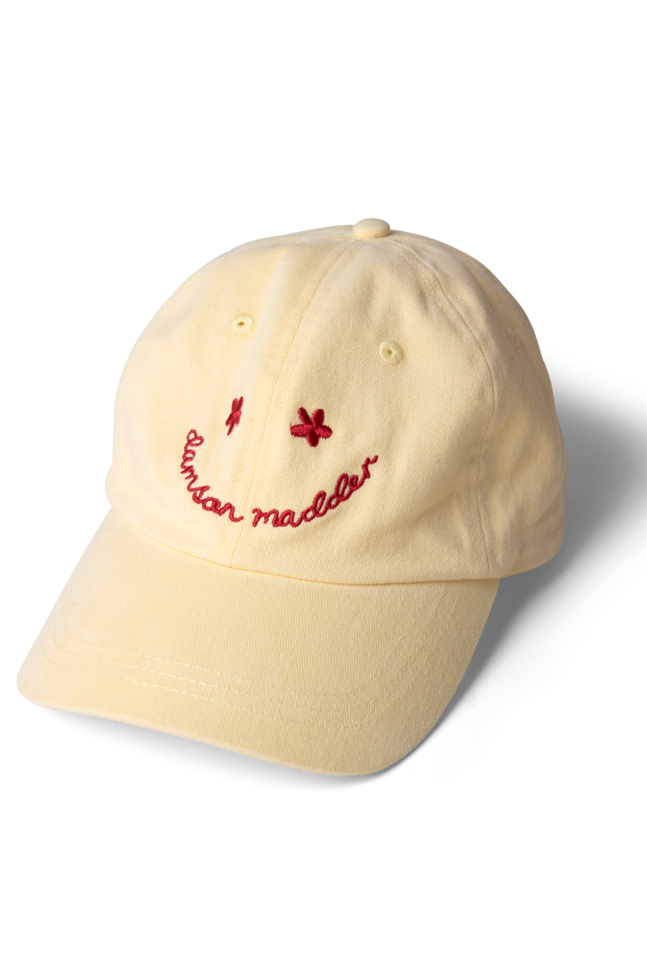 washed smiley cap in butter with red embroidery